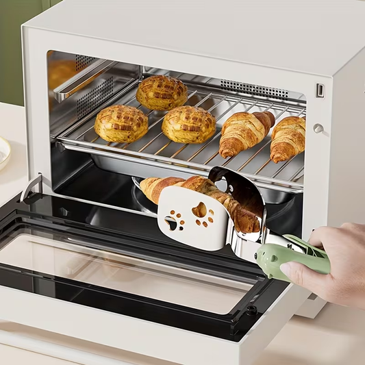 Stainless steel fish spatula, which can be used as both a tong and a spatula.